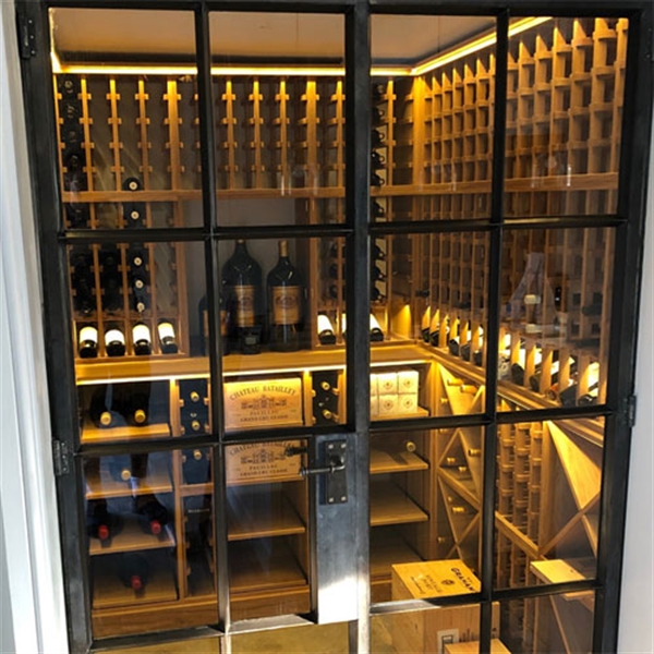 Large private wine room using solid oak racking in Oxfordshire