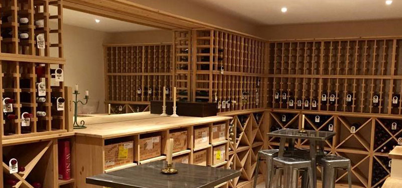 Wineware wine cellar, large private wine room using solid pine racking in Hampshire, UK.