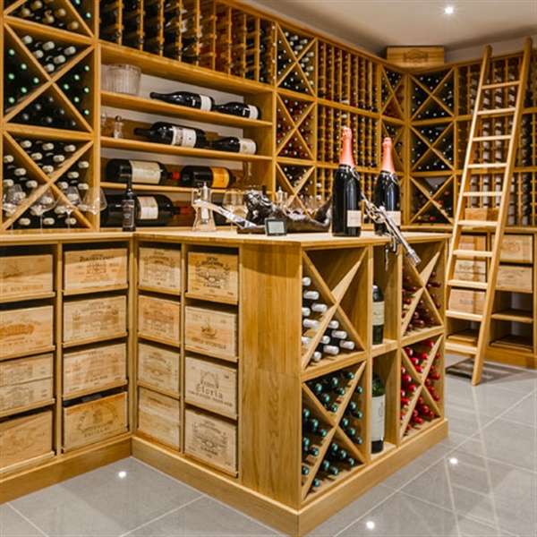 Large private residential wine room in London, using oak racking, cubes, case racks and more