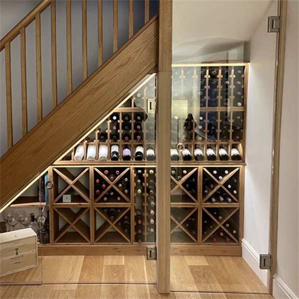 Under stairs wine cellar made from solid pine in a residential property in Leicestershire