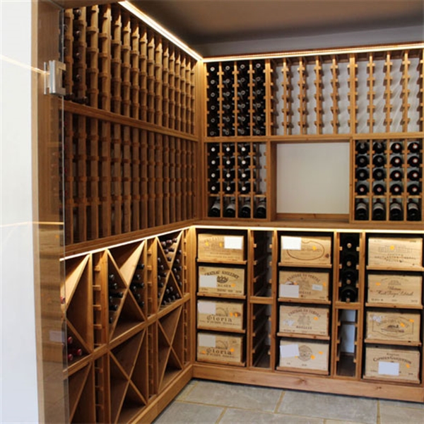 Medium size residential wine room in West Sussex with purpose-built double glass doors