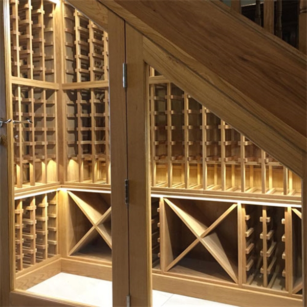 Under stairs wine cellar made from solid oak in a residential property in East Sussex