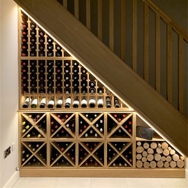 Under stairs wine racking made from solid pine in a residential property in Cheshire