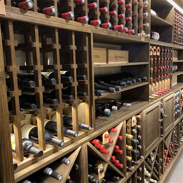 Private wine room using solid pine racking in Northamptonshire
