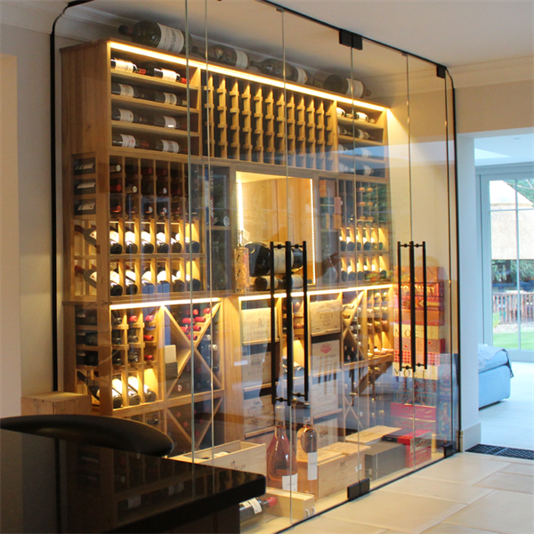 Glass enclosed luxurious oak wine wall in a residential property, Sunningdale, Berkshire